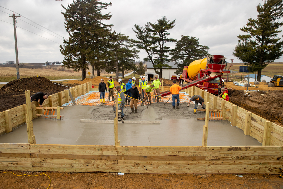 Students pouring concrete at the Commercial Construction Lab.