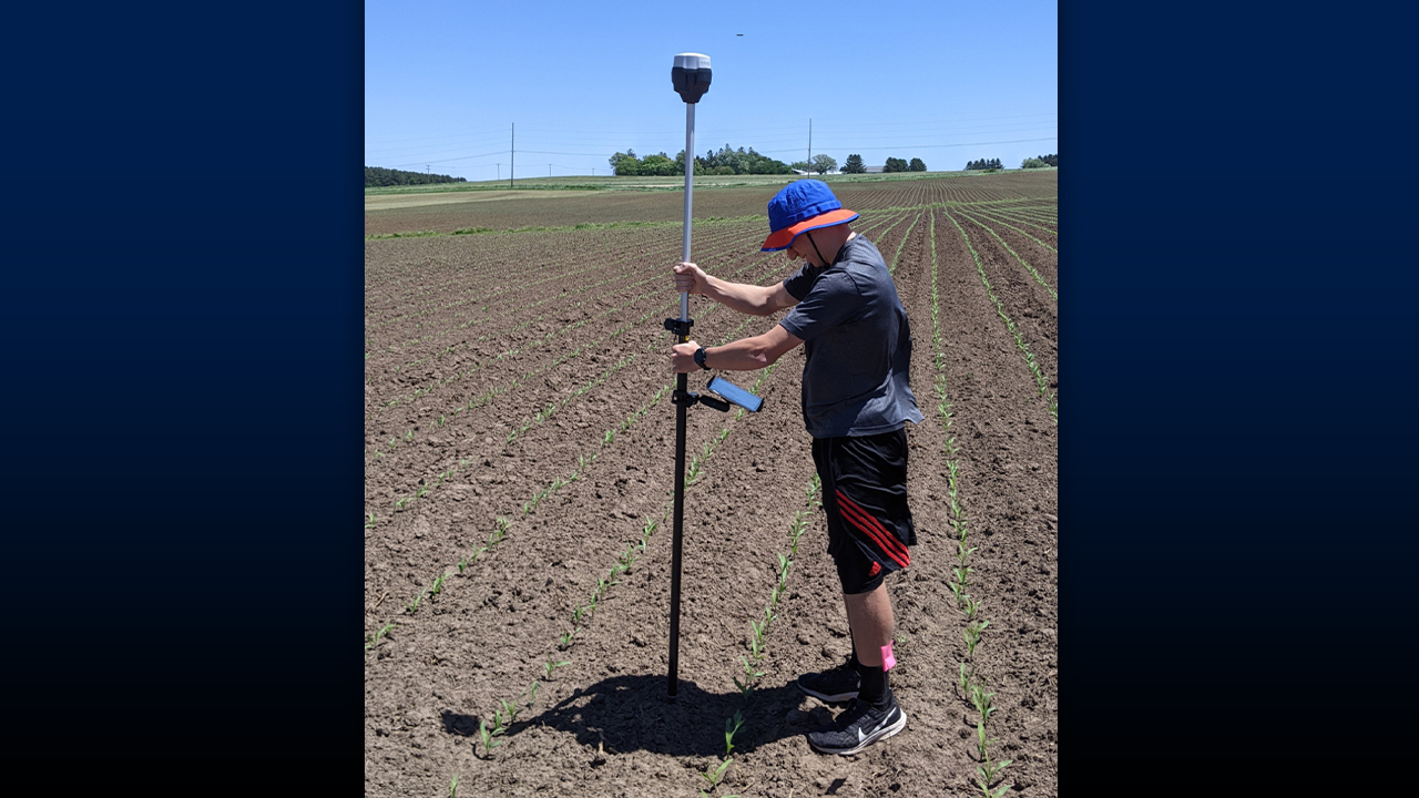 Student using technology in the study of precision agriculture.