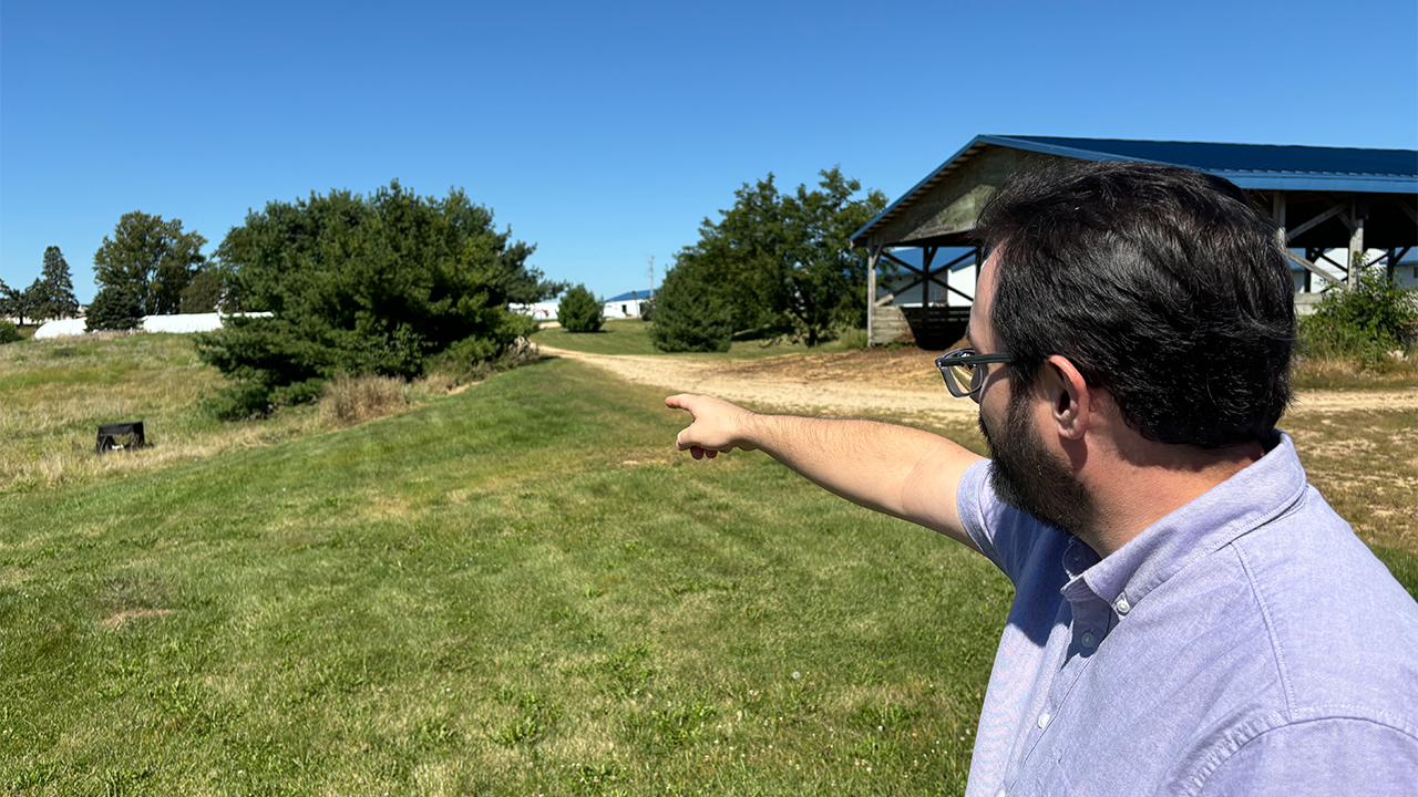 Dr. LeSuer points to one of the tents that’s used by students to conduct ongoing research into the specific climate related effects on body decomposition.