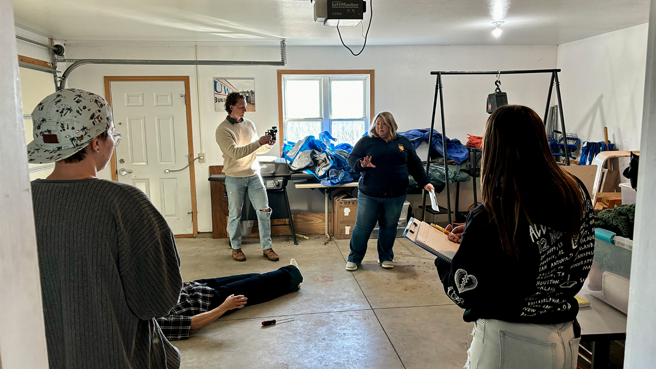 Students in the Medicolegal Death Investigation course collaborating at the Forensic Investigation Crime Scene House (FICSH) under the guidance of Forensic Anthropologist and Assistant Professor Dr. Janamarie Truesdell.