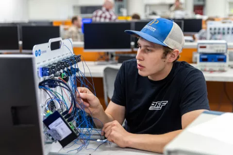 A student working in the Electronics and Automation Lab.