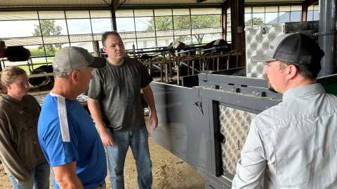 Dr. Ryan Prolle overseeing the installation of the GreenFeed machine at Pioneer Farm.