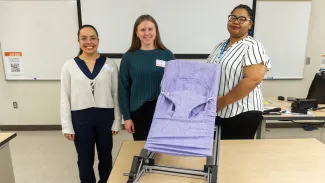 Taylor Nisius, Bryanne Pinkowski and JJ Hilliard pictured with their Gentle Jumps chair.