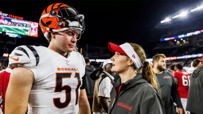 Coach Kearstin Schweitzer with former UW-Platteville Defensive Linemen Justin Blazek.