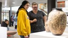 Students enjoy ceramic vessels during Small Works Exhibition 2022