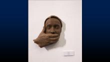 "Silenced " by Greg Senn, 2023, 11 x 9 x 3 inches, resin sand, $200