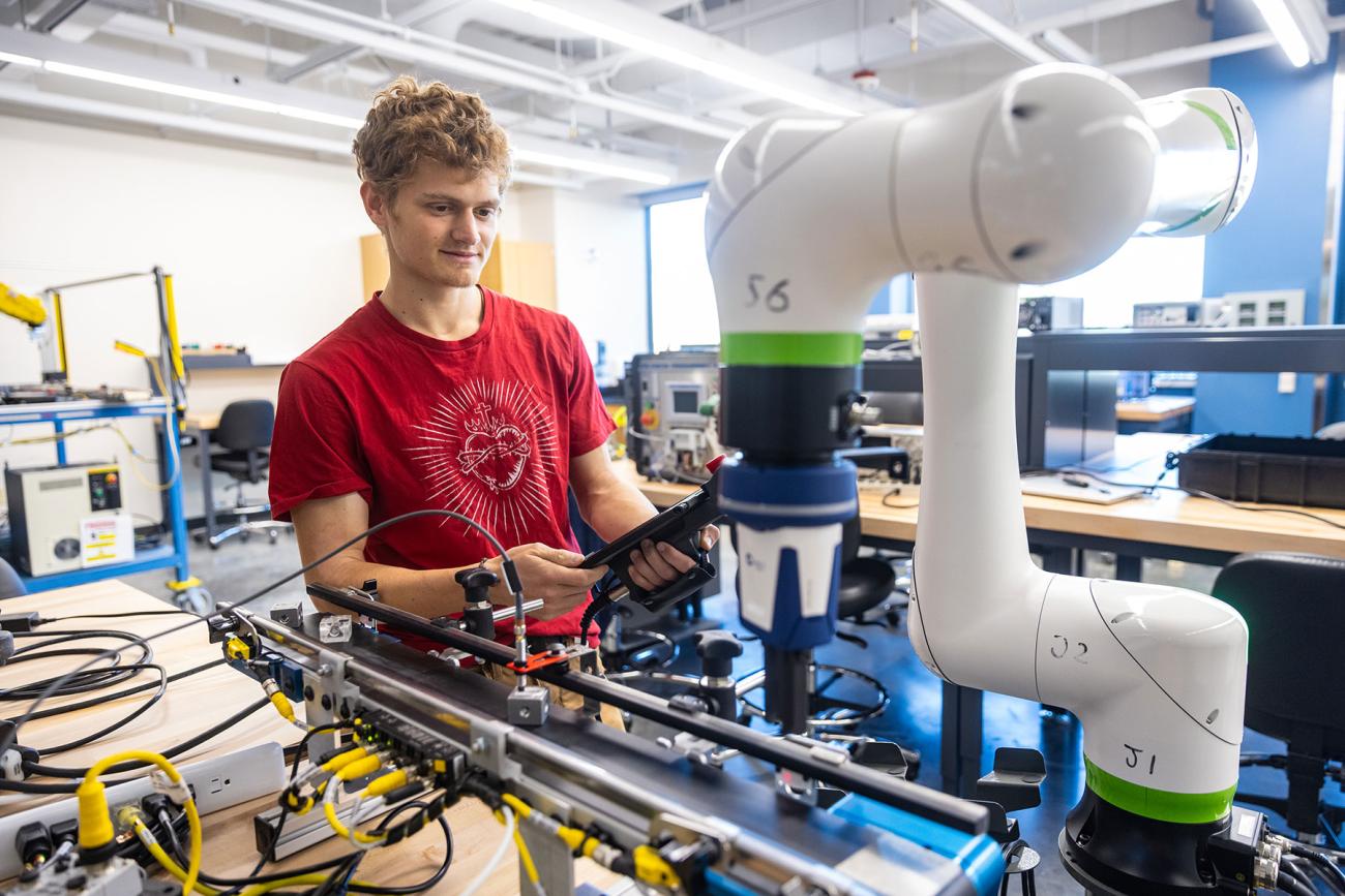 instructor and professor working with students in iiot testbed