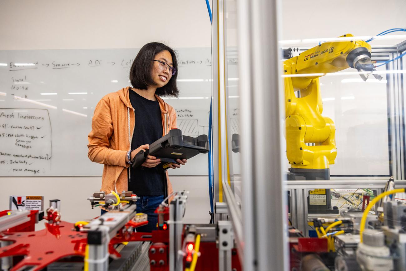 instructor and professor working with students in iiot testbed