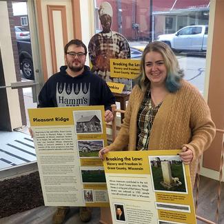 students setting up window exhibit on African American history