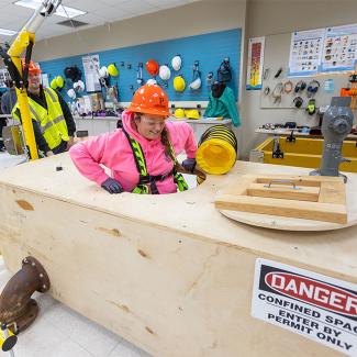 students using the confined space simulator