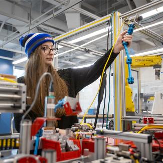 Student putting together system for testing