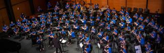 Tri-State Honors Band performing with guest conductor