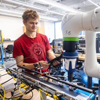 student using cobot in IIoT testbed