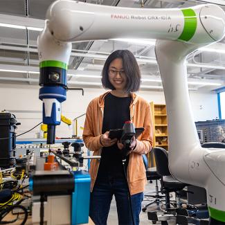 student using cobot in the lab