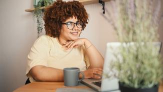 online student working on laptop