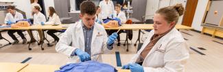 Physician assistant students practice medical skills