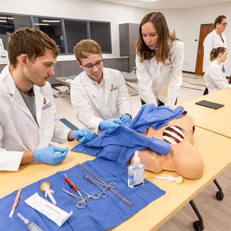 students practice medical techniques 