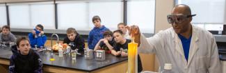 Professor giving chemistry demonstration during UW-Platteville STEM Expo