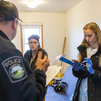 Forensic investigations students in Death Investigation class at crime scene house