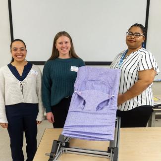 Taylor Nisius, Bryanne Pinkowski, and JJ Hilliard pictured their Gentle Jumps chair